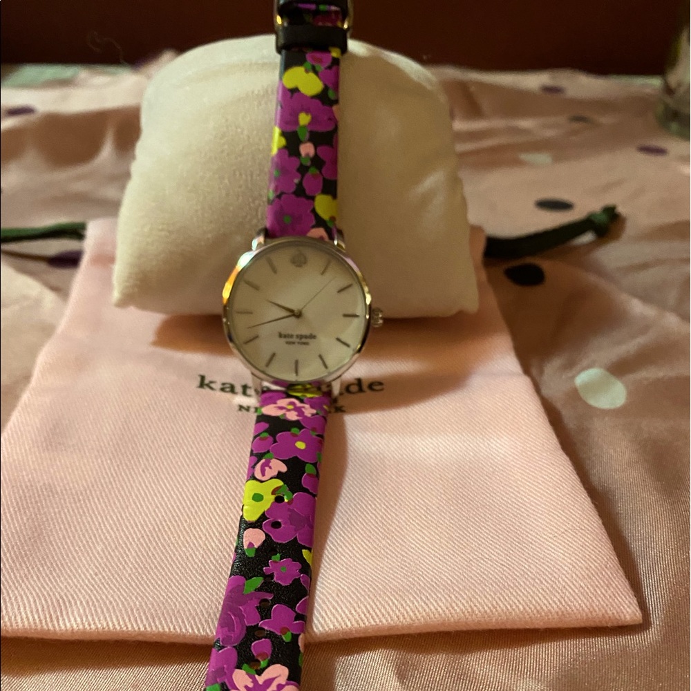 Mother of pearl face watch w/multi color band
